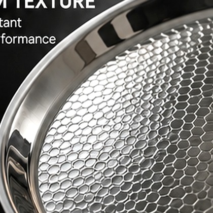 Honeycomb textured titanium cooking surface